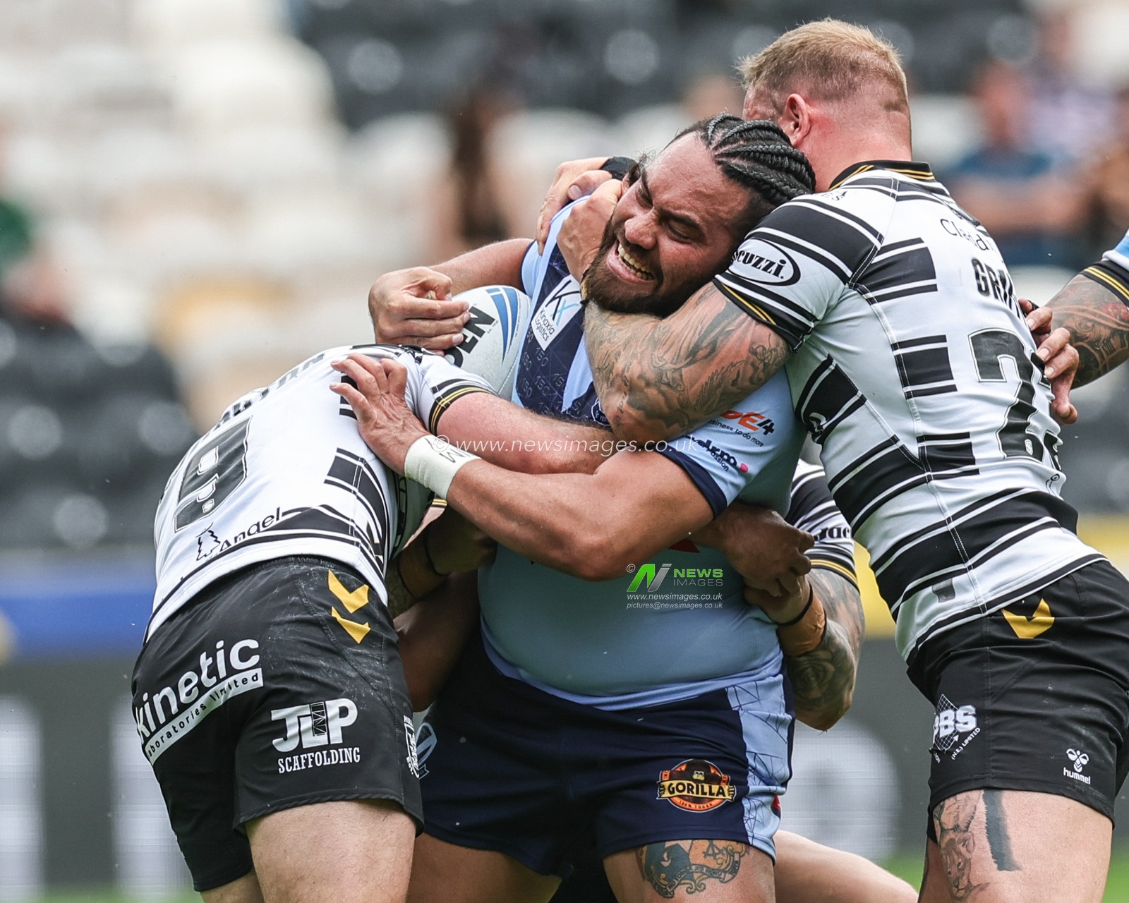 Konrad Hurrell #23 of St Helens is tackled by Liam Sutcliffe #4 of Hull FC, Danny Houghton #9 of Hull FC and Josh Griffin #23 of Hull FC during the Betfred Challenge Cup match Hull FC vs St Helens at MKM Stadium, Hull, United Kingdom, 17th June 2023

(Photo by Mark Cosgrove/News Images)