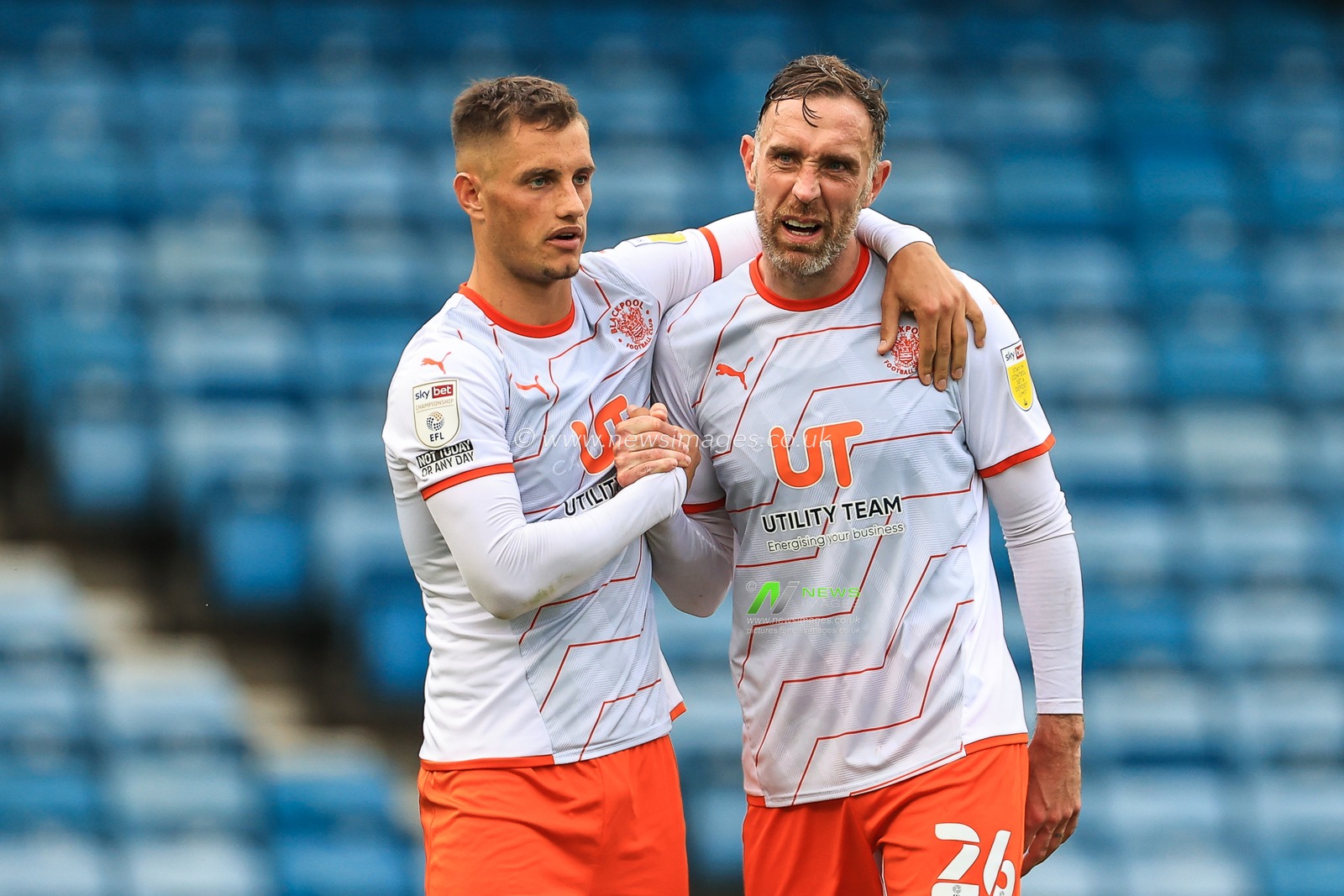 Jerry Yates #9 of Blackpool and Richard Keogh #26 console each other after they lose 2-1 to Millwall