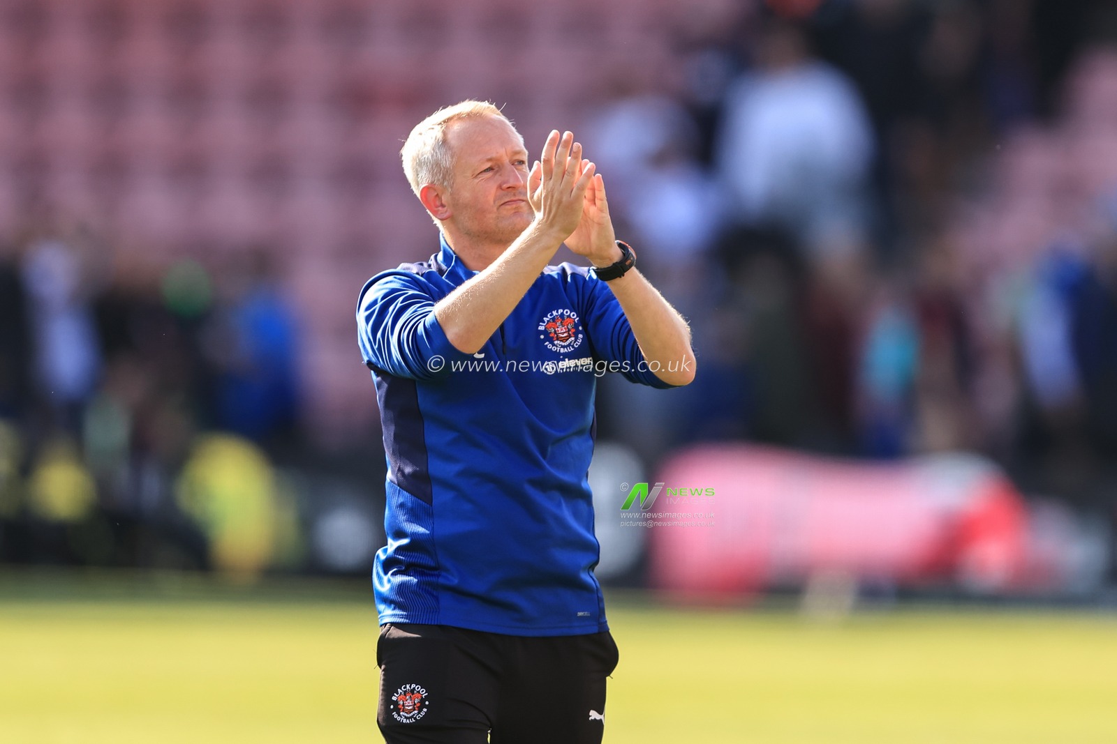 Neil Critchley Head Coach of Blackpool applauds the traveling fans as Blackpool take a 2-2 draw after coming back for being two goals down