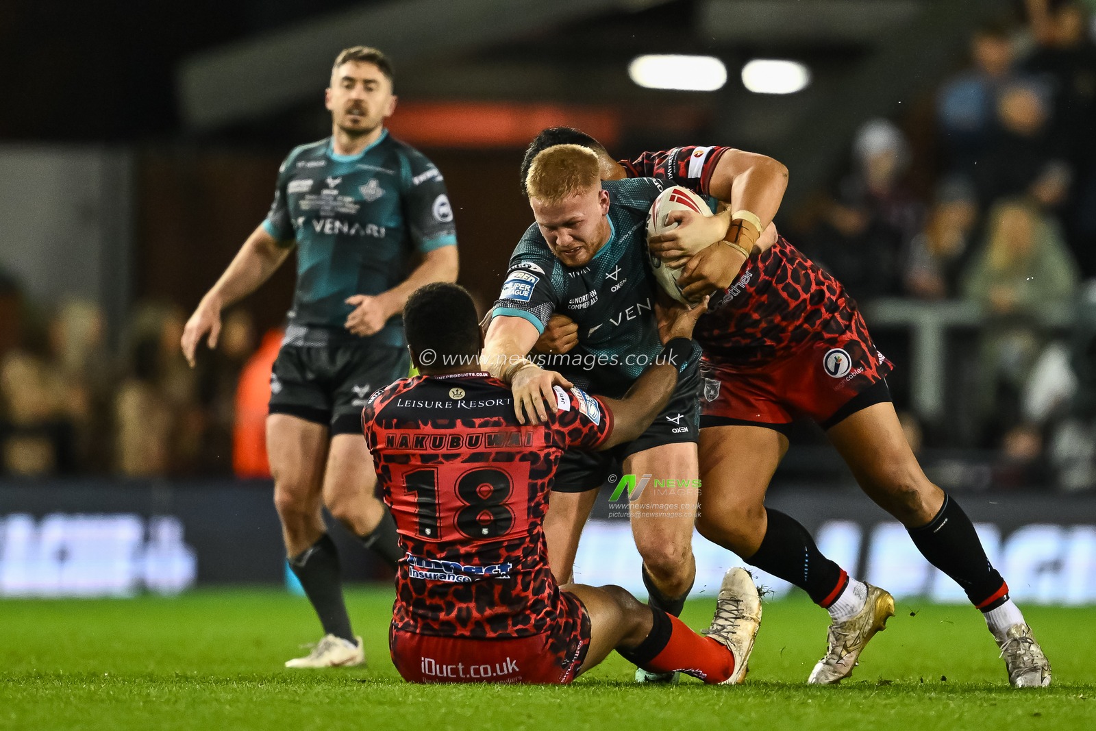 Matty English of Huddersfield Giants is tackled by Ben Nakubuwai of Leigh Leopards during the Betfred Super League Round 1 match Leigh Leopards vs Huddersfield Giants at Leigh Sports Village, Leigh, United Kingdom, 16th February 2024

(Photo by Craig Thomas/News Images)