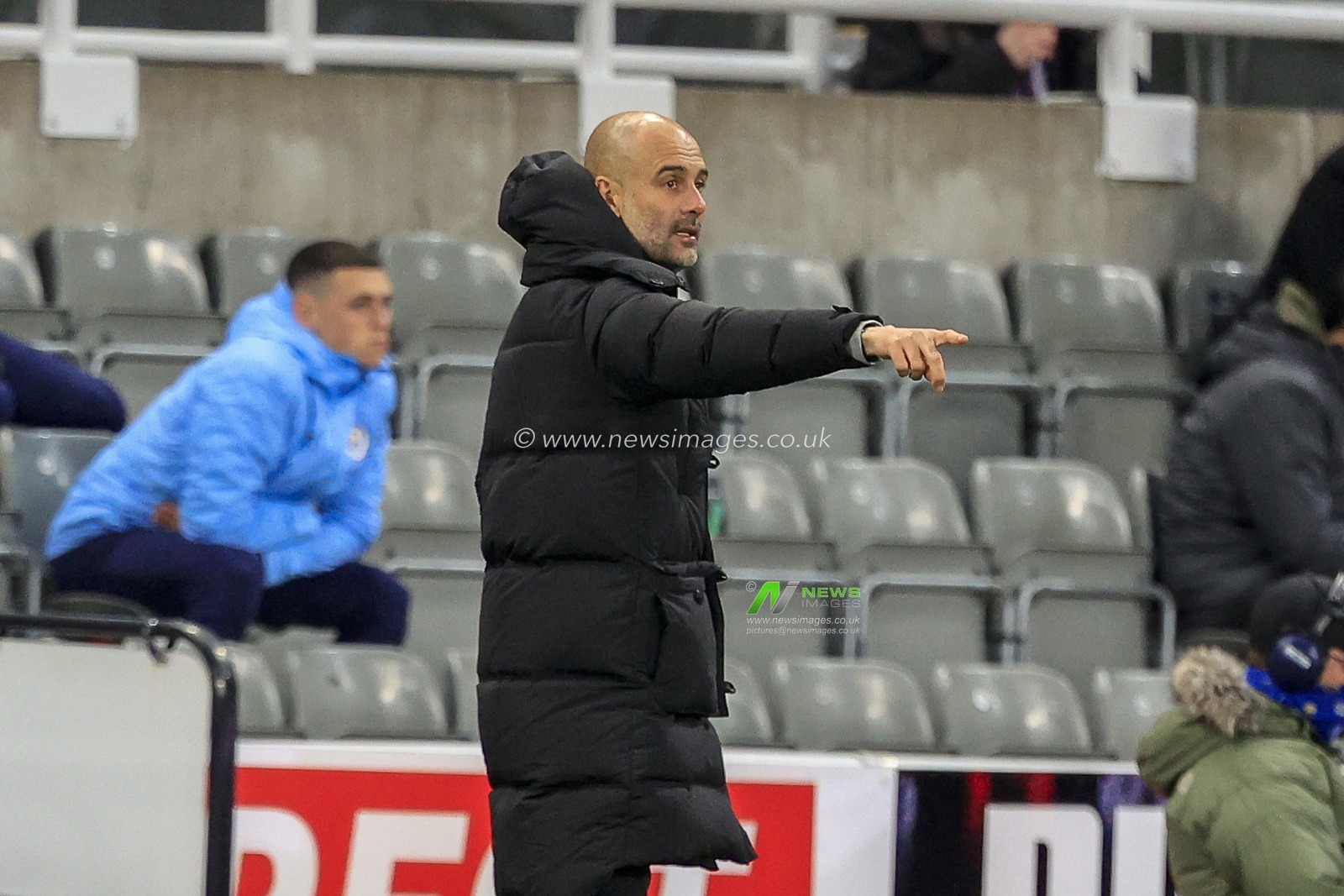 Pep Guardiola, Manager of Manchester City, gives his team instructions