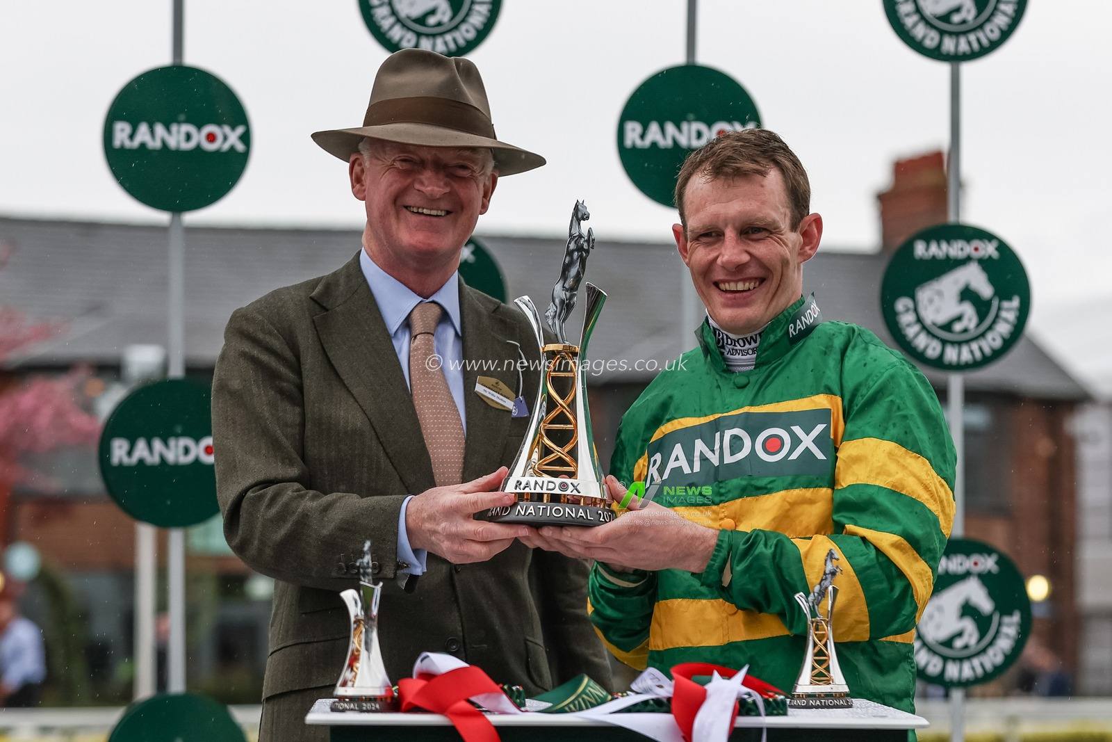 Willie Mullins (L) and Paul Townend (R) with the winners trophy after I Am Maximus wins the 16:00 Randox Grand National Handicap Chase during the Randox Grand National Day 2024 at Aintree Racecourse, Liverpool, United Kingdom, 13th April 2024

(Photo by Mark Cosgrove/News Images)