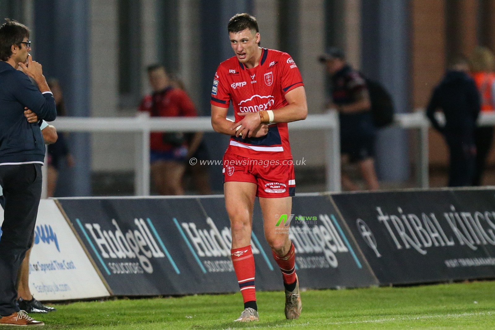 Sam Wood #24 of Hull KR walks down the side line after receiving an injury