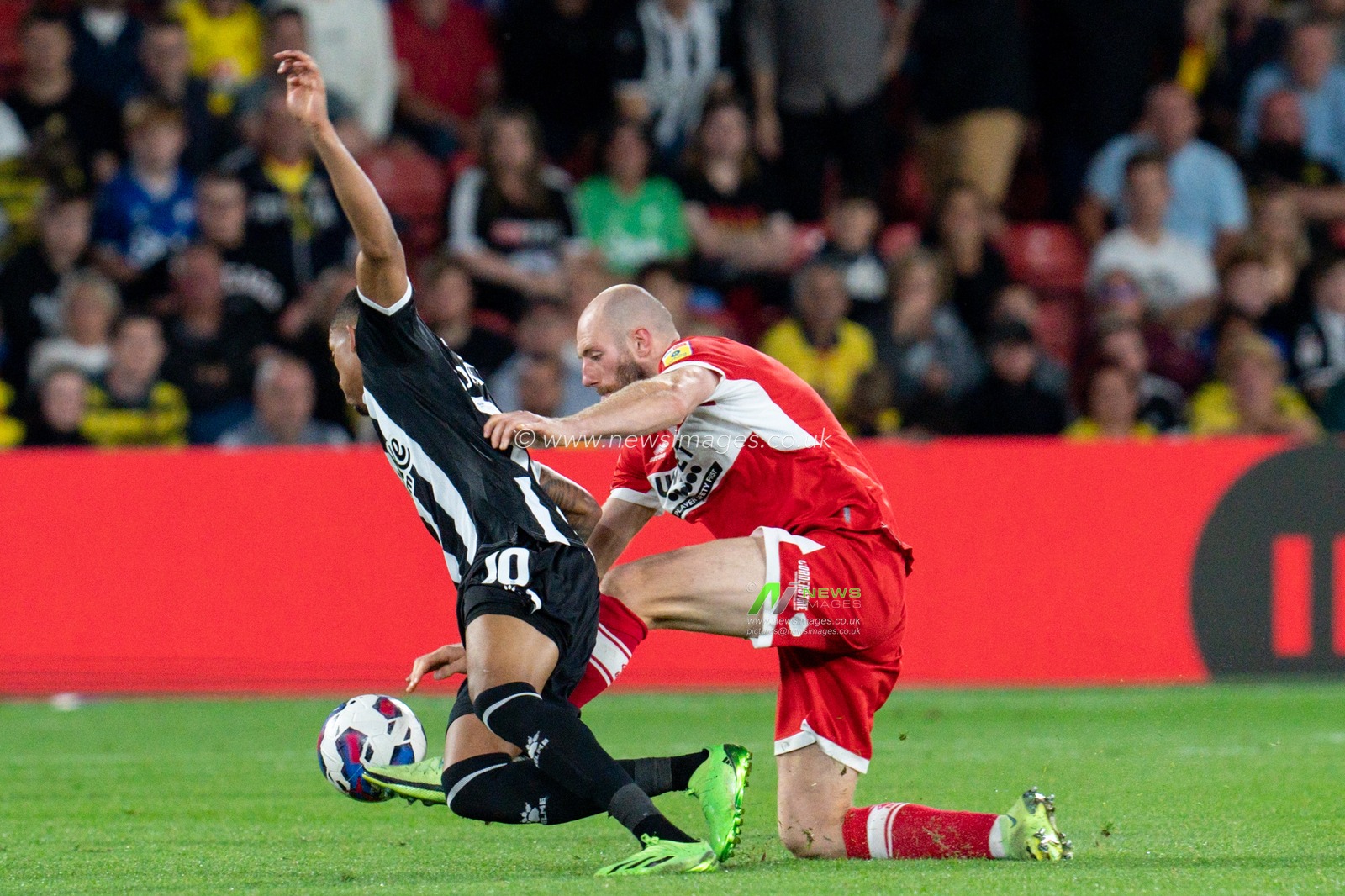 JoÃ£o Pedro #10 of Watford battle for the ball with Matthew Clarke of Middlesbrough