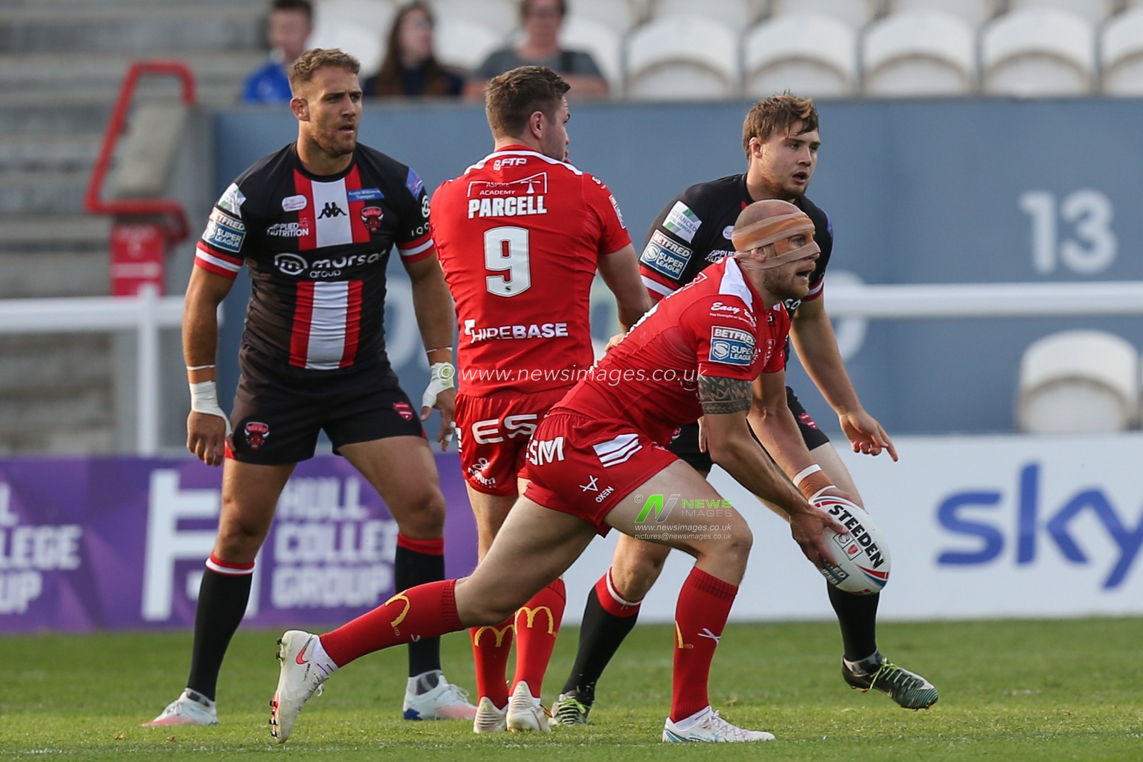 Dean Hadley (13) of Hull KR sets to pass the ball