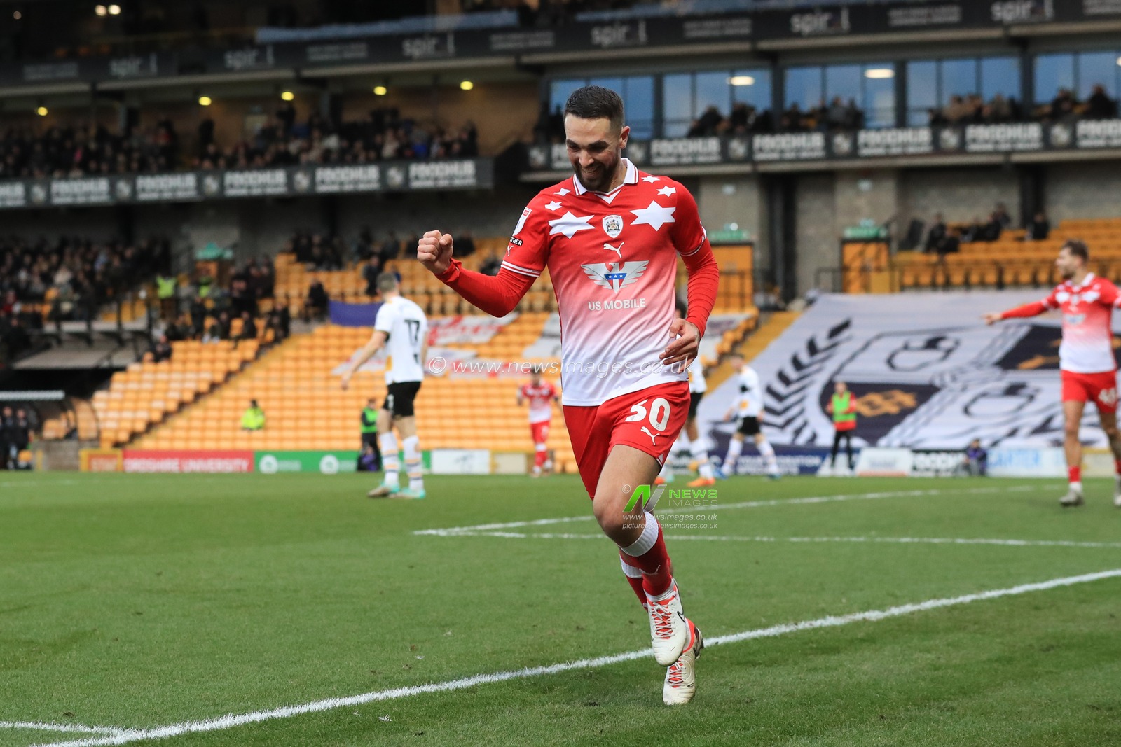 Adam Phillips #30 of Barnsley celebrates his goal to make it 0-1 during the Sky Bet League 1 match Port Vale vs Barnsley at Vale Park, Burslem, United Kingdom, 26th December 2023

(Photo by Alfie Cosgrove/News Images)