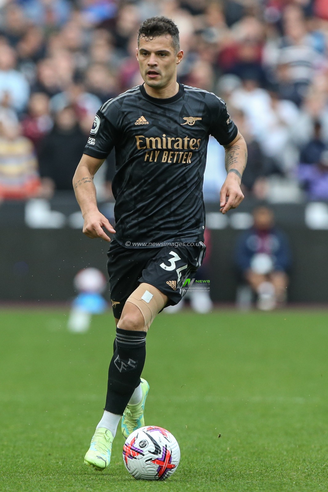 Granit Xhaka #34 of Arsenal with the ball during the Premier League match West Ham United vs Arsenal at London Stadium, London, United Kingdom, 16th April 2023

(Photo by Arron Gent/News Images)