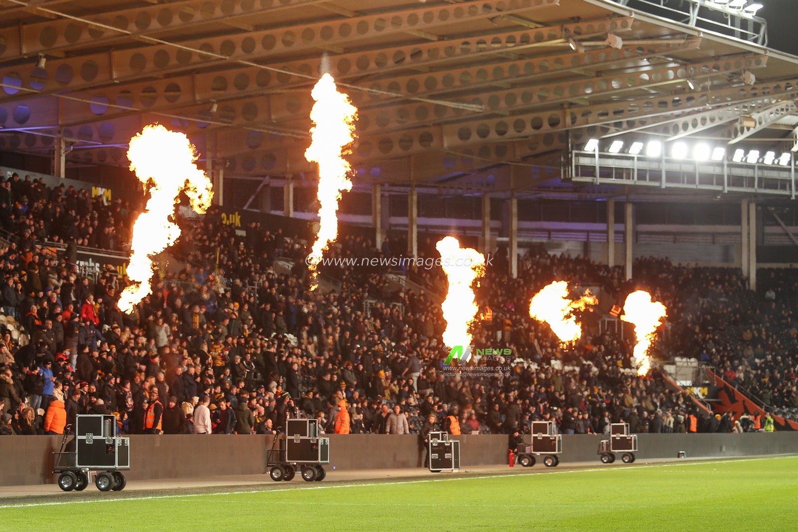 Pyrotechnics light up the East Stand at the MKM Stadium