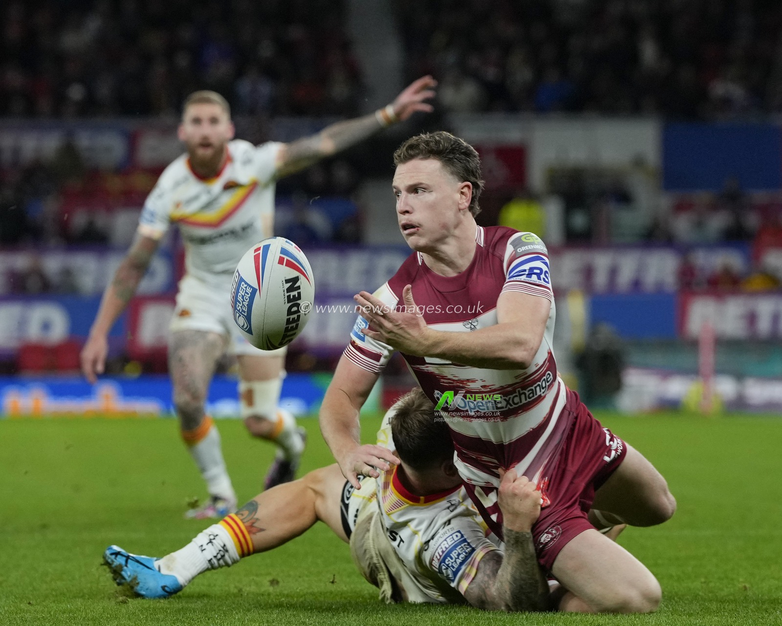 Jai Field #1 of Wigan Warriors offloads the ball during the Betfred Super League Grand Final match Wigan Warriors vs Catalans Dragons at Old Trafford, Manchester, United Kingdom, 14th October 2023

(Photo by Steve Flynn/News Images)