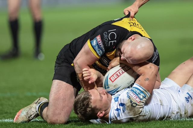 Olly Ashall-Bott of Toulouse Olympique is tackled by Paul McShane of York Knights during the Betfred Super League round 9 match York Knights vs Toulouse at LNER Community Stadium, York, United Kingdom on 23 April 2026

(Photo by Mark Cosgrove/News Images)