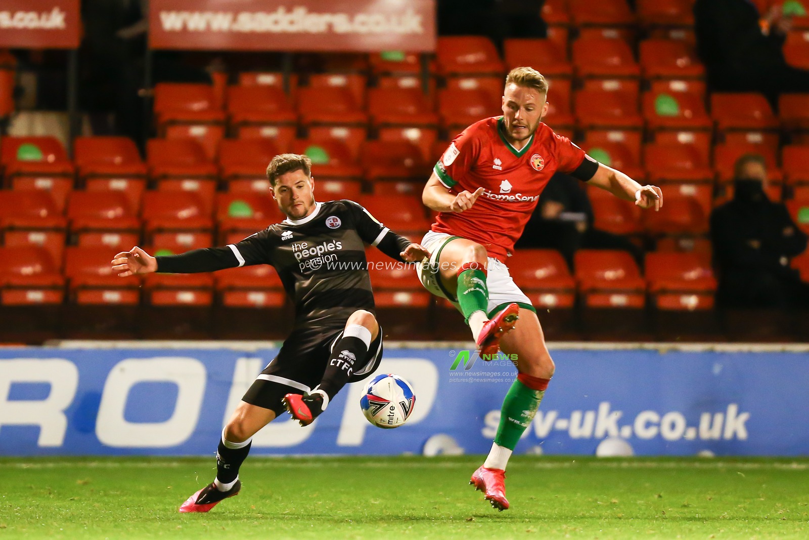 Josh Doherty (3) of Crawley Town and Liam Kinsella (8) of Walsall compete for the ball