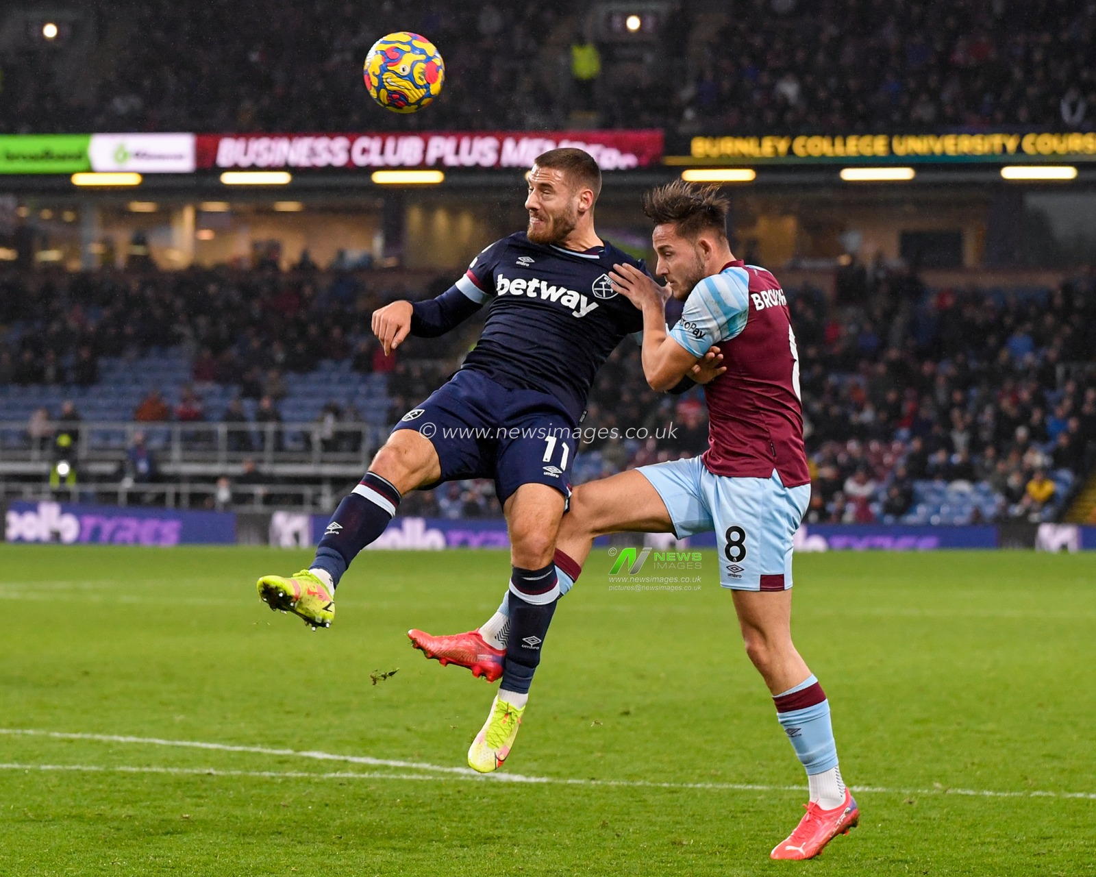 Nikola Vlasic #11 of West Ham United and Josh Brownhill #8 of Burnley compete for the ball