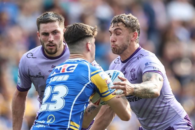 Riley Lumb of Leeds Rhinos is tackled by Sam Powell of Warrington Wolves during the Betfred Super League Round 14 Leeds Rhinos v Warrington Wolves at Headingley Stadium, Leeds, United Kingdom, 14th June 2025

(Photo by Mark Cosgrove/News Images)