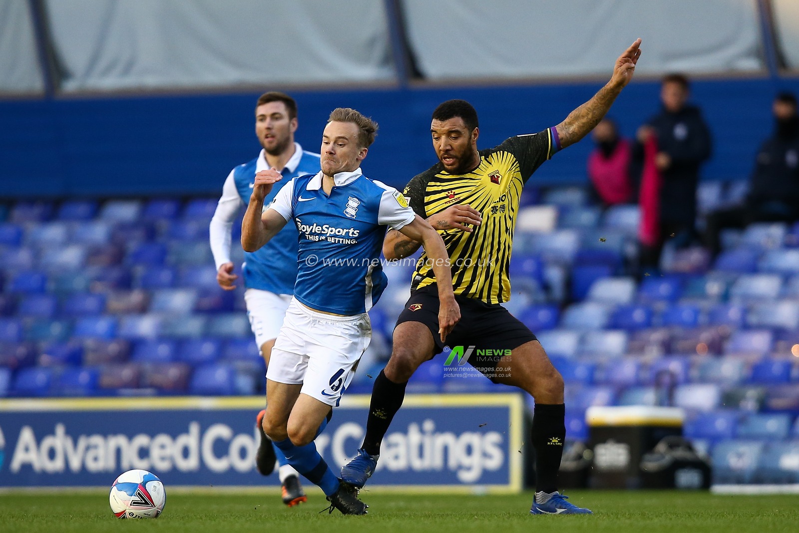 Troy Deeney #9 of Watford fouls Maikel Kieftenbeld #6 of Birmingham City