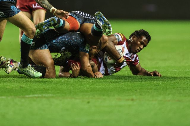 Junior Nsemba of Wigan Warriors is tackled during the Betfred Super League Semi Final 1 match Wigan Warriors vs Leigh Leopards at The Brick Community Stadium, Wigan, United Kingdom, 3rd October 2025

(Photo by Alfie Cosgrove/News Images)