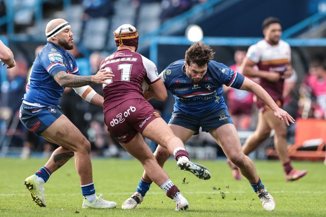 George Flanagan Jnr of Huddersfield Giants is tackled by Jazz Tevaga of Wakefield Trinity during the Betfred Super League Round 2 match Huddersfield Giants vs Wakefield Trinity at Accu Stadium, Huddersfield, United Kingdom on 22 February 2026

(Photo by Mark Cosgrove/News Images)