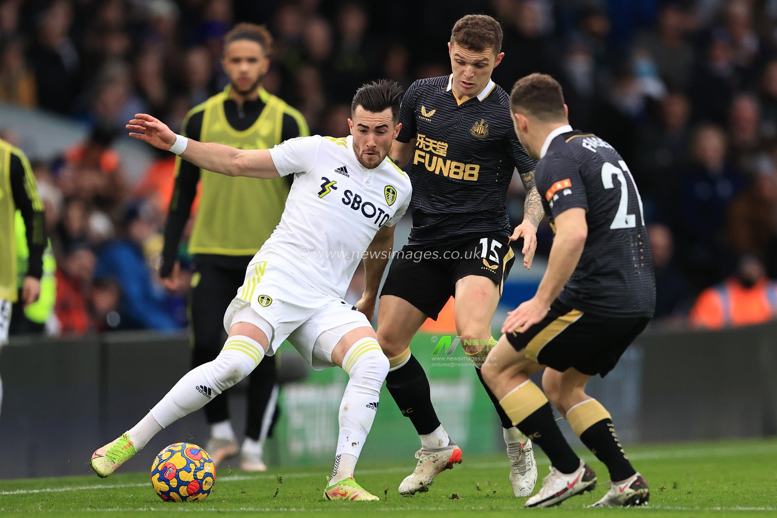 Jack Harrison #22 of Leeds United holds the ball from Ryan Fraser #21 of Newcastle United and Kieran Trippier #15 of Newcastle United during the Premier League fixture Leeds United vs Newcastle United at Elland Road, Leeds, UK, 22nd January 2022