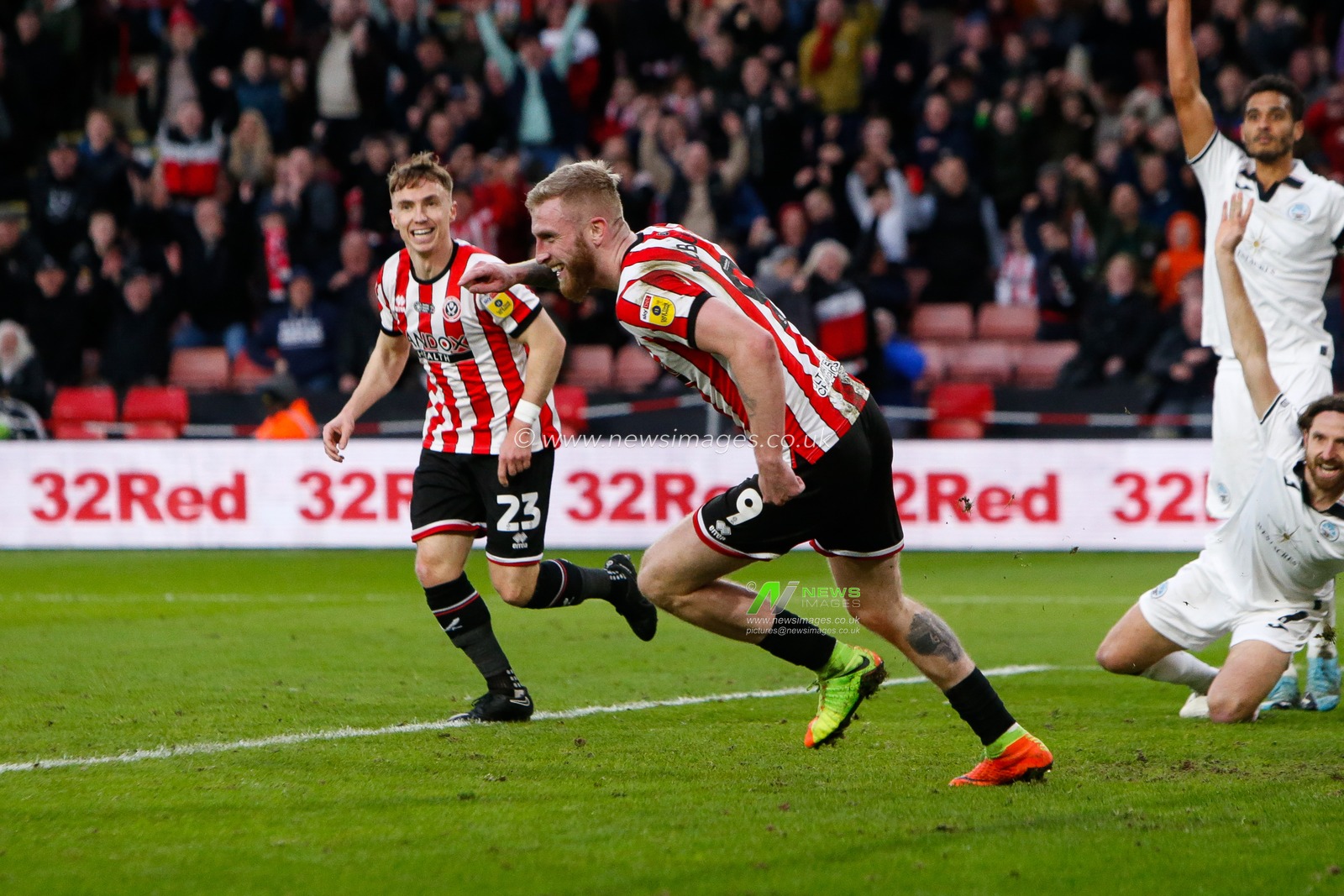Oliver McBurnie #9 of Sheffield United Celebrates scoring a goal to make it 3-0 during the Sky Bet Championship match Sheffield United vs Swansea City at Bramall Lane, Sheffield, United Kingdom, 11th February 2023

(Photo by Ben Early/News Images)