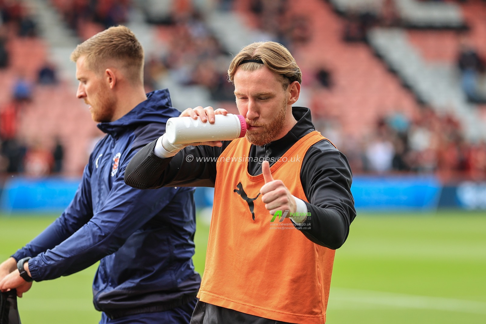 Josh Bowler #11 of Blackpool giving the thumbs up as he has a drink