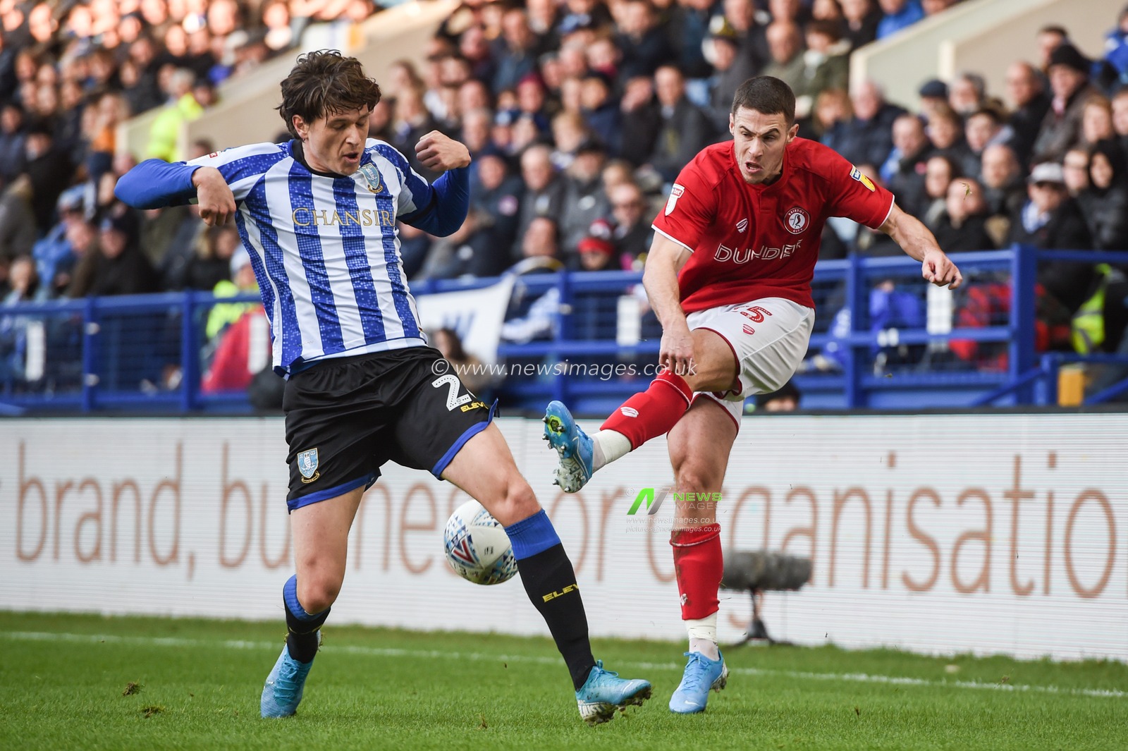 22nd December 2019, Hillsborough, Sheffield, England; Sky Bet Championship, Sheffield Wednesday v Bristol City : 
Adam Reach (20) of Sheffield Wednesday blocks a cross from Tommy Rowe (25) of Bristol City 
Credit: Dean Williams/News Images