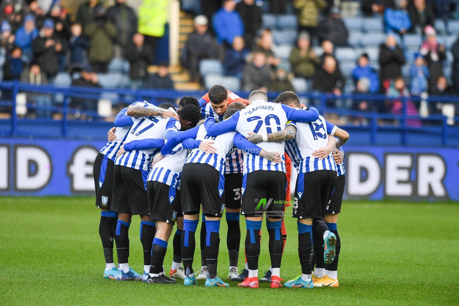 The Sheffield Wednesday players form a huddle before the game