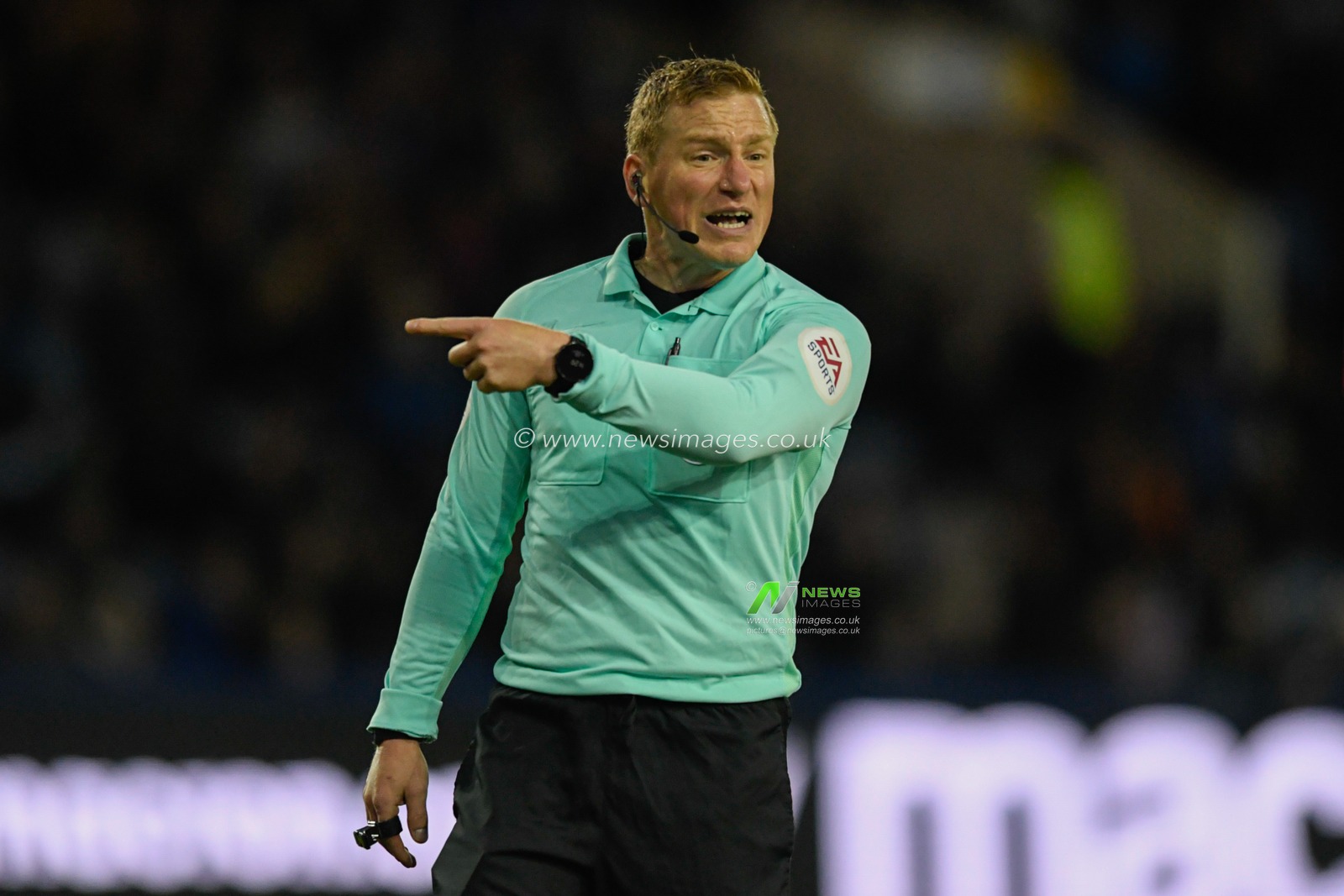 Referee John Busby in action during the game