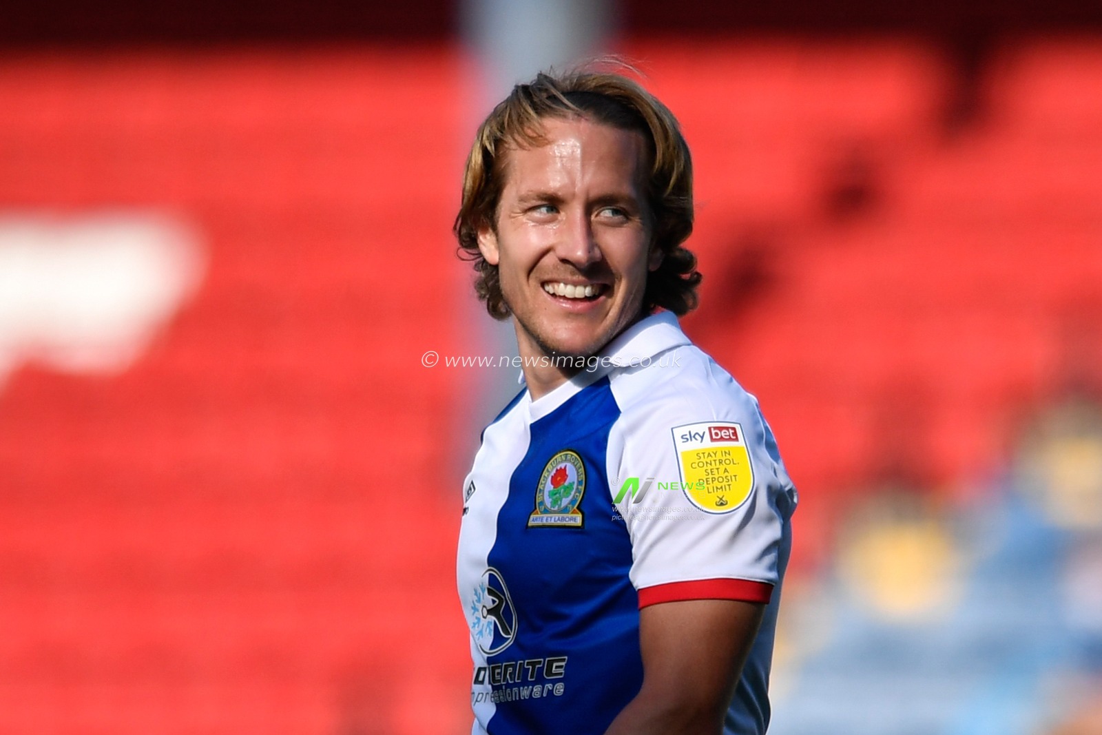 Lewis Holtby (10) of Blackburn Rovers smiles while looking over his shoulder