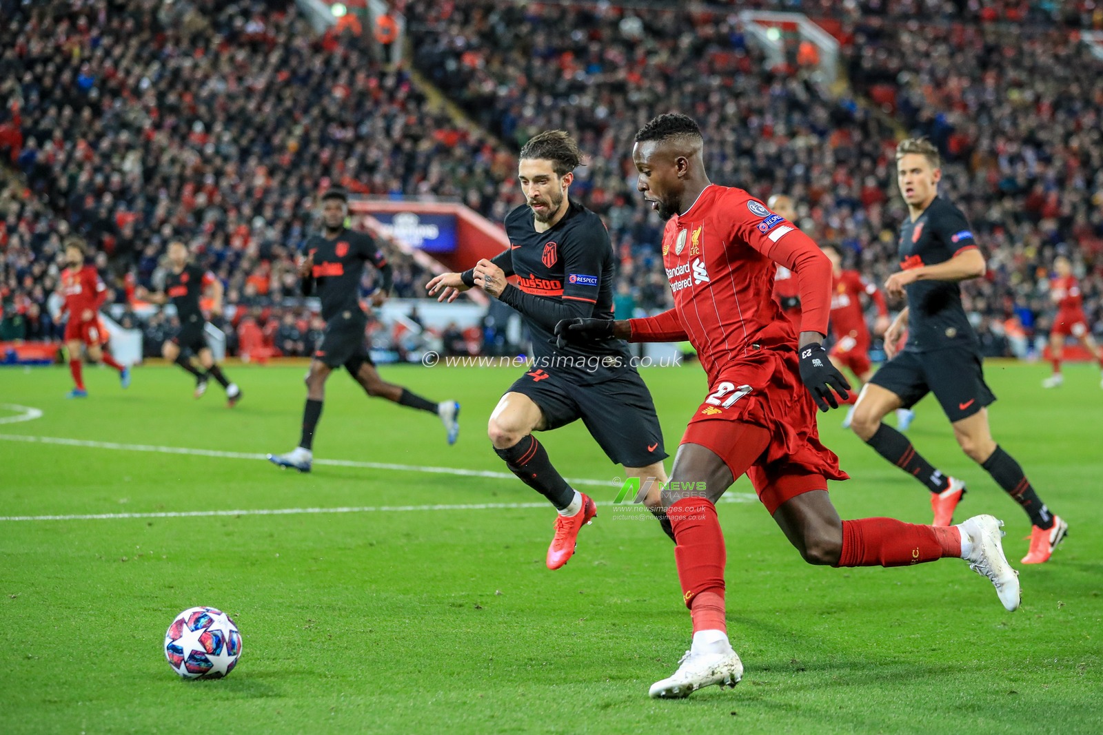 11th March 2020, Anfield, Liverpool, England; UEFA Champions League, Round of 16 Leg 2 of 2, Liverpool v Atletico Madrid : Divock Origi (27) of Liverpool breaks with the ball