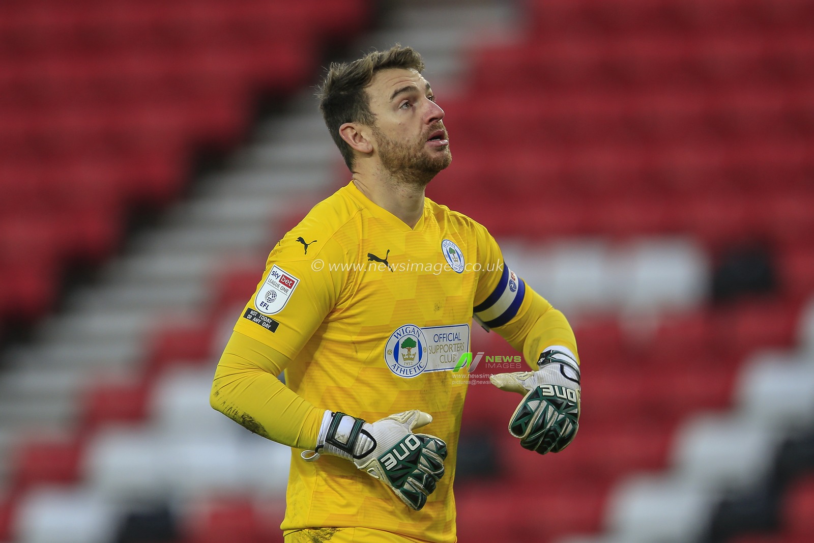 Jamie Jones #1 of Wigan Athletic looks up during the game