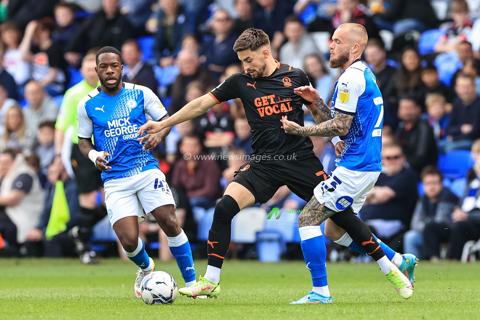 Owen Dale #7 of Blackpool is fouled by Joe Ward #23 of Peterborough United