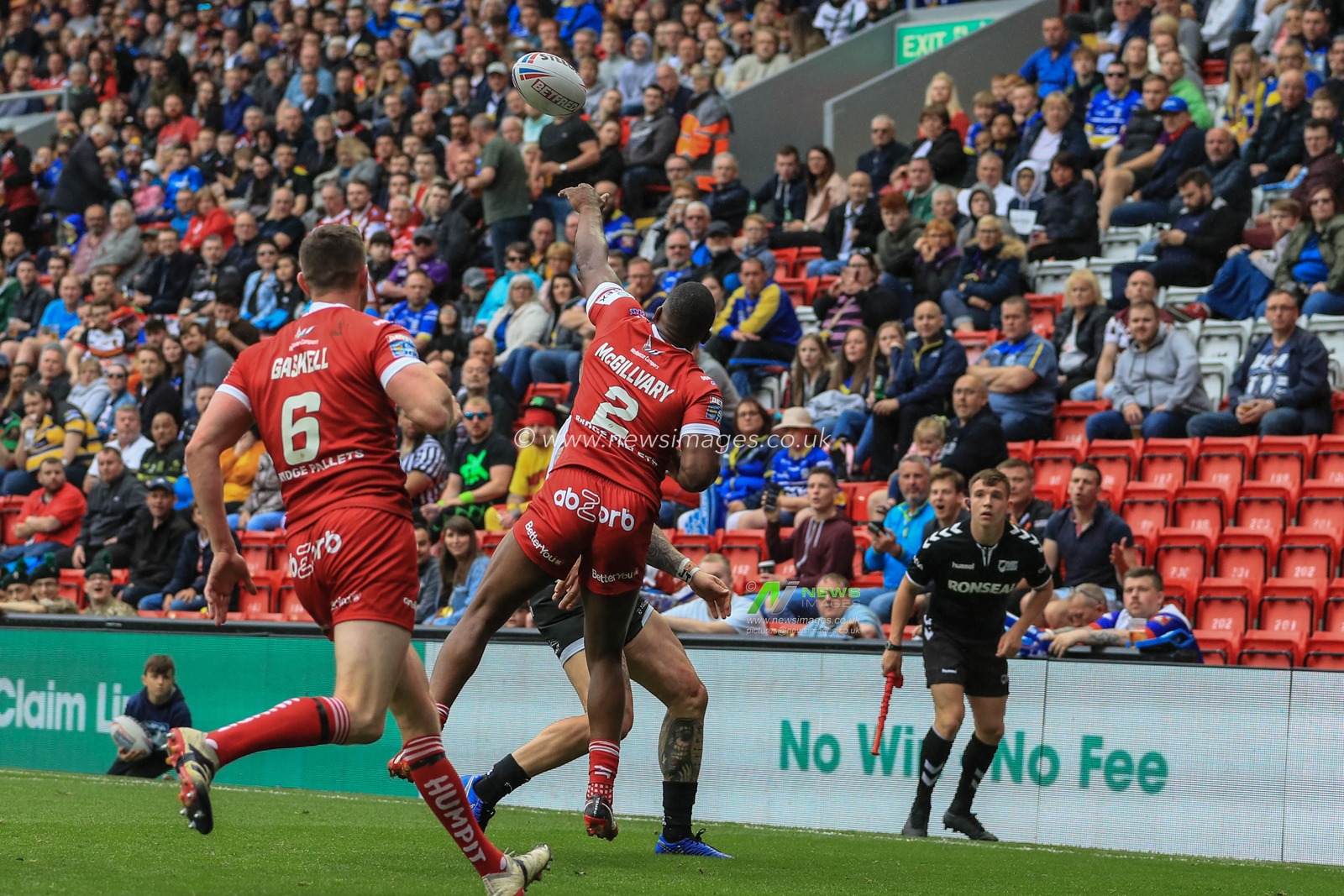 25th May 2019 , Anfield Stadium, Liverpool, England; Dacia Magic Weekend, Betfred Super League Round 16, Hull FC vs Huddersfield Giants ; Jermaine McGillvary (2) of Huddersfield Giants punches the ball out of play 

Credit: Mark Cosgrove/News Images