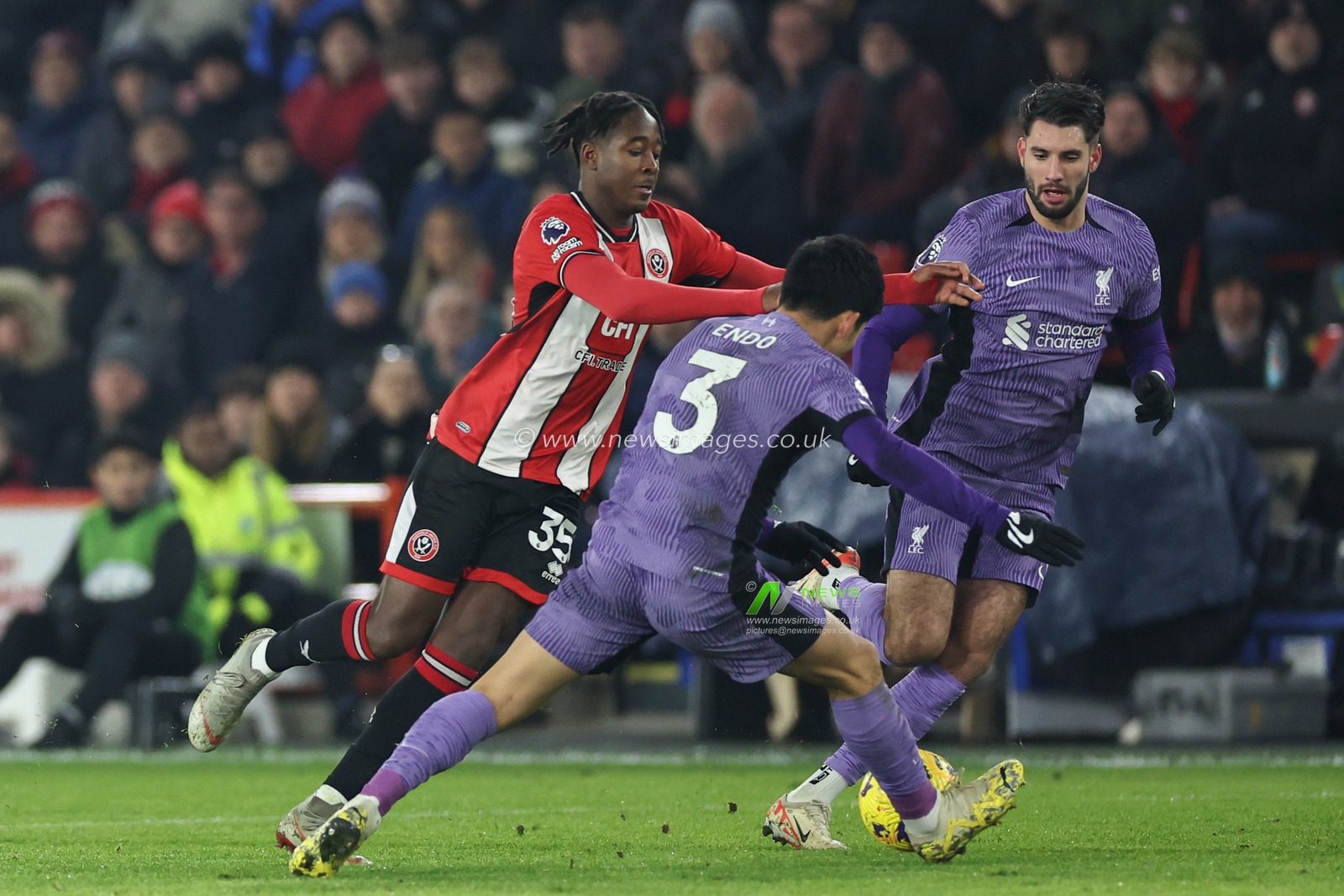 Andre Brooks #35 of Sheffield United is tackled by Wataru Endo #3 of Liverpool during the Premier League match Sheffield United vs Liverpool at Bramall Lane, Sheffield, United Kingdom, 6th December 2023

(Photo by Mark Cosgrove/News Images)