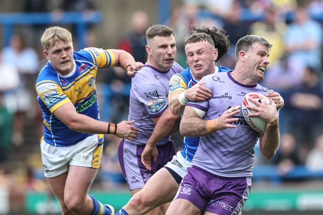 Lachlan Fitzgibbon of Warrington Wolves is tackled during the Betfred Super League Round 14 Leeds Rhinos v Warrington Wolves at Headingley Stadium, Leeds, United Kingdom, 14th June 2025

(Photo by Mark Cosgrove/News Images)