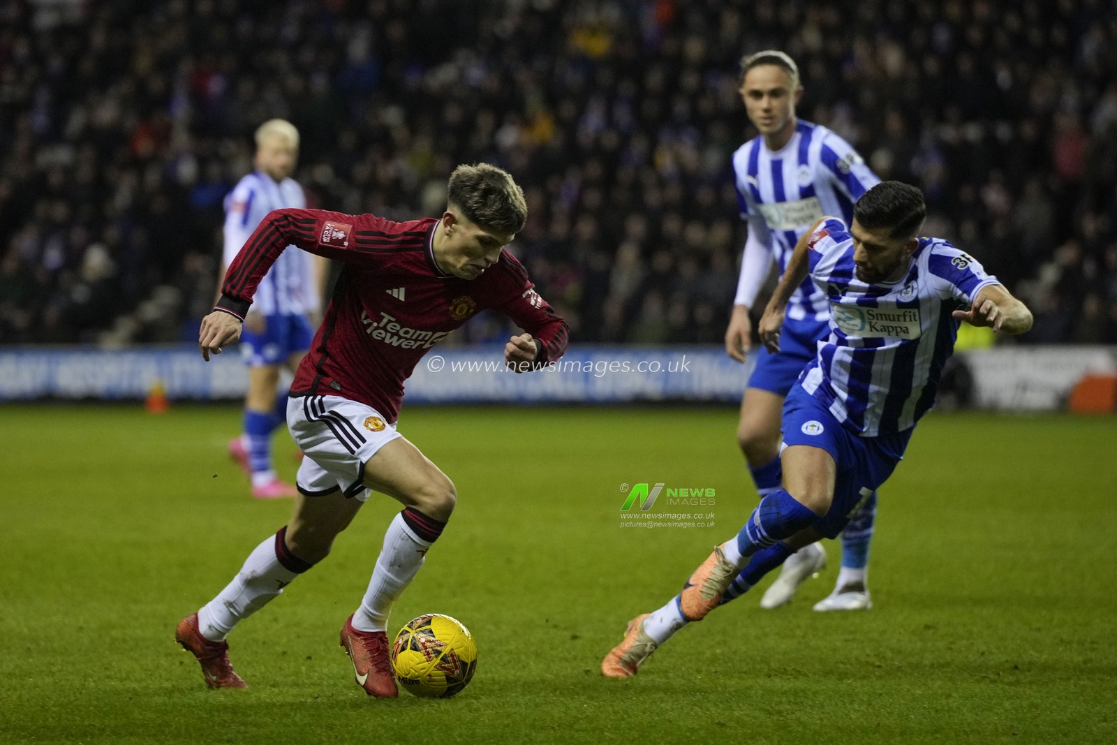 Alejandro Garnacho of Manchester United runs at the Wigan Athletic defence during the Emirates FA Cup Third Round match Wigan Athletic vs Manchester United at DW Stadium, Wigan, United Kingdom, 8th January 2024

(Photo by Steve Flynn/News Images)