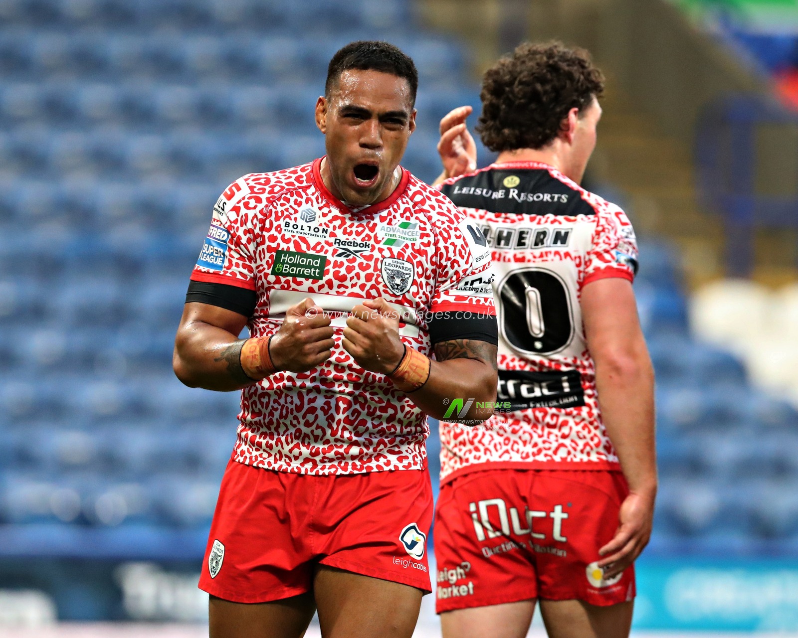 Joe Ofahengaue of Leigh Leopards celebrates the try scored by Isaac Liu of Leigh Leopards during the Betfred Super League Round 13 match Huddersfield Giants vs Leigh Leopards at John Smith's Stadium, Huddersfield, United Kingdom, 29th May 2025

(Photo by Sam Eaden/News Images)
