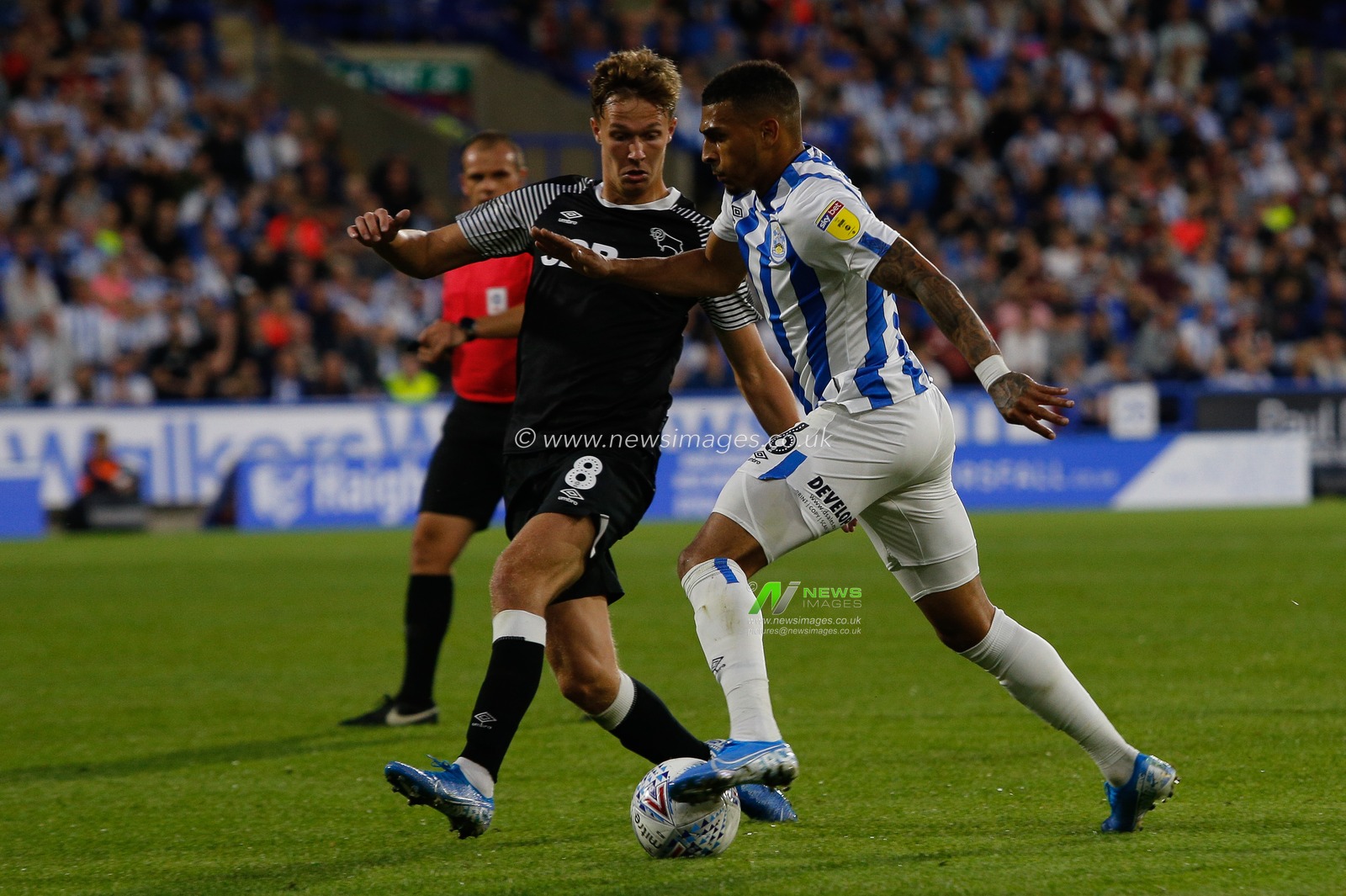 5th August 2019, John Smiths Stadium, Huddersfield England; Sky Bet Championship, Huddersfield Town vs Derby County ; Karlan Grant (16) of Huddersfield Town and Kieran Dowell (8) of Derby County  tussle for the ball


Credit: Kurt Fairhurst/News Images

English Football League images are subject to DataCo Licence