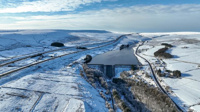 Heavy Snow over the hills of Scammonden Bridge and Booth Wood Reservoir areas of West Yorkshire and a free running M62 where the farm house sits in the middle of the motorway, Kirklees, United Kingdom, 11th January 2025

(Photo by Mark Cosgrove/News Images)