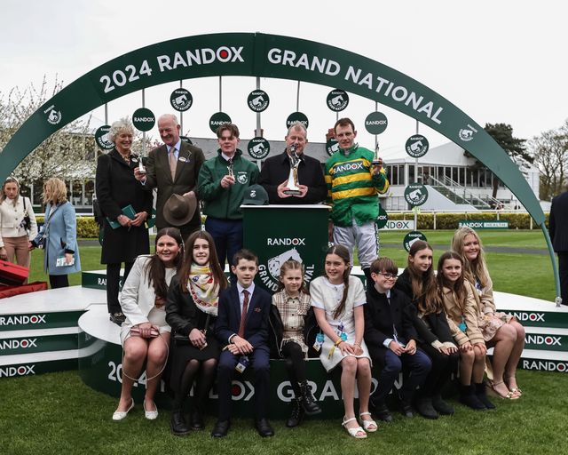 Paul Townend, Willie Mullins, and I Am Maximus owner John P McManus are presented with their trophyâ€™s for winning the 16:00 Randox Grand National Handicap Chase during the Randox Grand National Day 2024 at Aintree Racecourse, Liverpool, United Kingdom, 13th April 2024

(Photo by Mark Cosgrove/News Images)