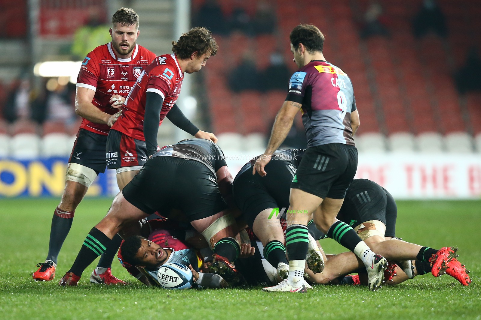 Nathan Earle #14 of Harlequins pushes the ball out the ruck