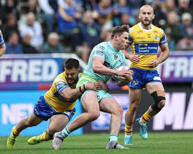 Jack Welsby of St. Helens is tackled by James Bentley of Leeds Rhinos during the Betfred Magic Weekend 2025 match St Helens vs Leeds Rhinos at St. James's Park, Newcastle, United Kingdom, 3rd May 2025

(Photo by Mark Cosgrove/News Images)