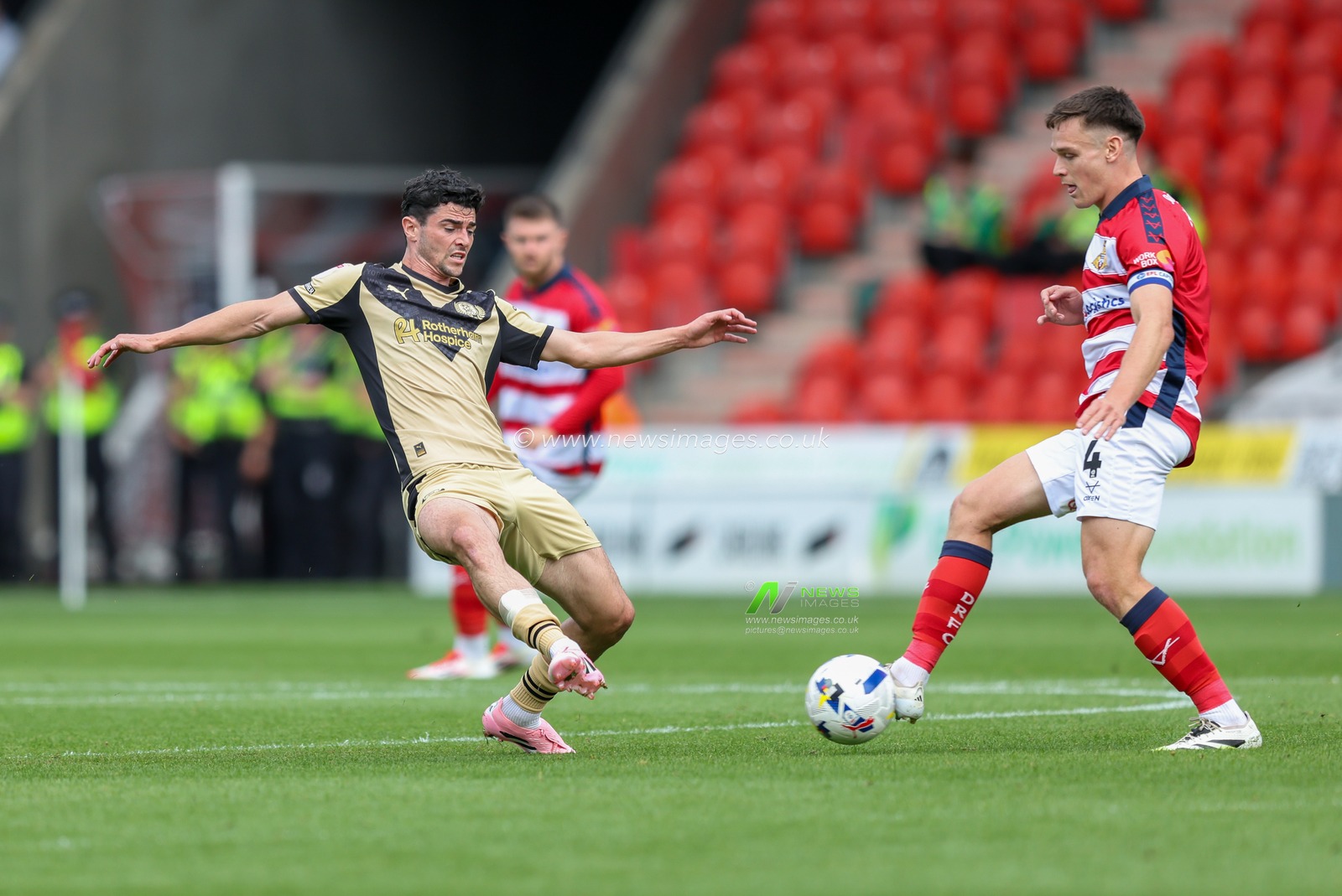 Joe Rafferty of Rotherham United challenges Owen Bailey of Doncaster Rovers during the Sky Bet League 1 match Doncaster Rovers vs Rotherham United at Eco-Power Stadium, Doncaster, United Kingdom, 30th August 2025

(Photo by Alex Roebuck/News Images)