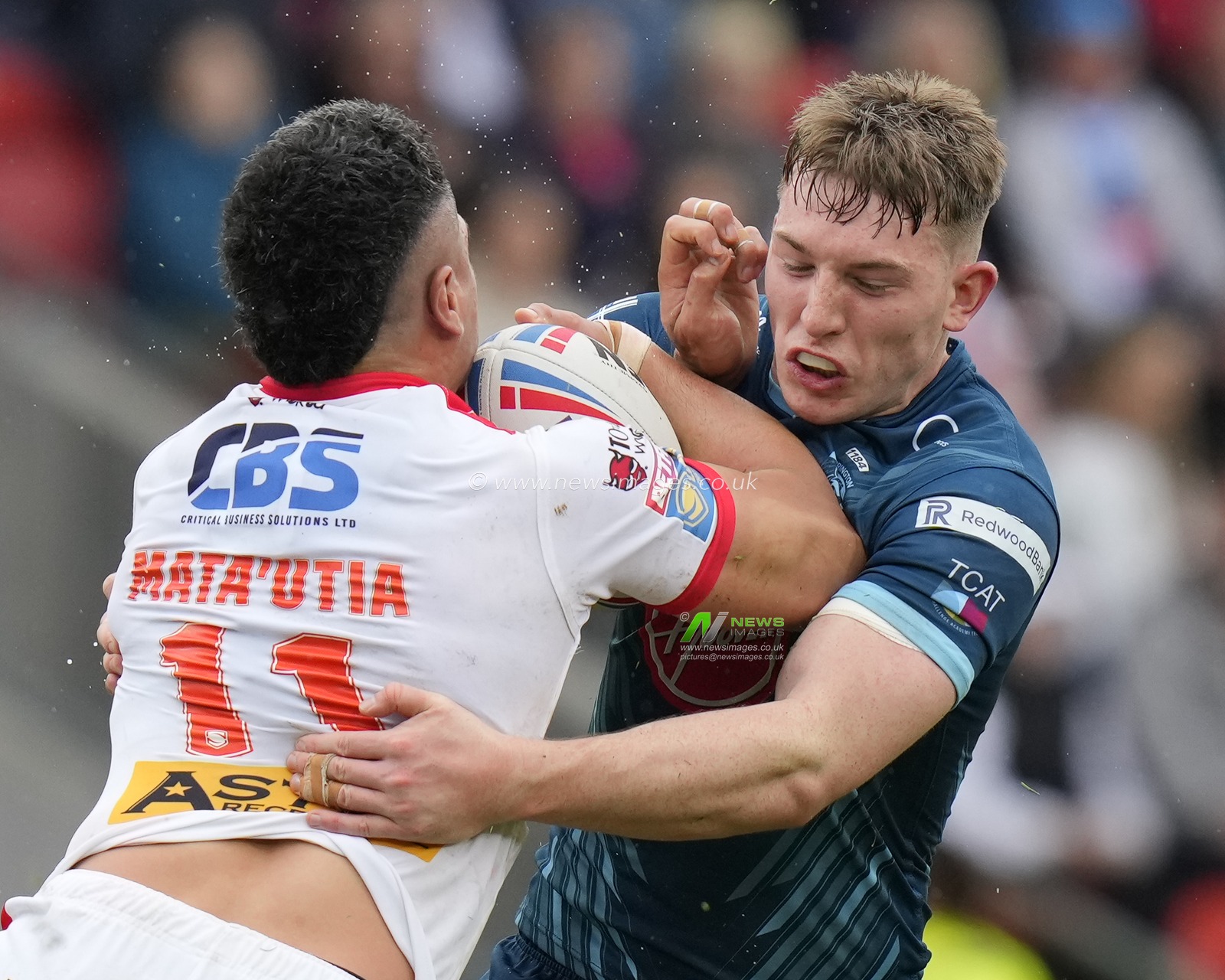Matty Nicholson #12 of Warrington Wolves tackles Sione Mataâ€™utia #11 of St. Helens during the Betfred Super League Eliminator match St Helens vs Warrington Wolves at Totally Wicked Stadium, St Helens, United Kingdom, 30th September 2023

(Photo by Steve Flynn/News Images)