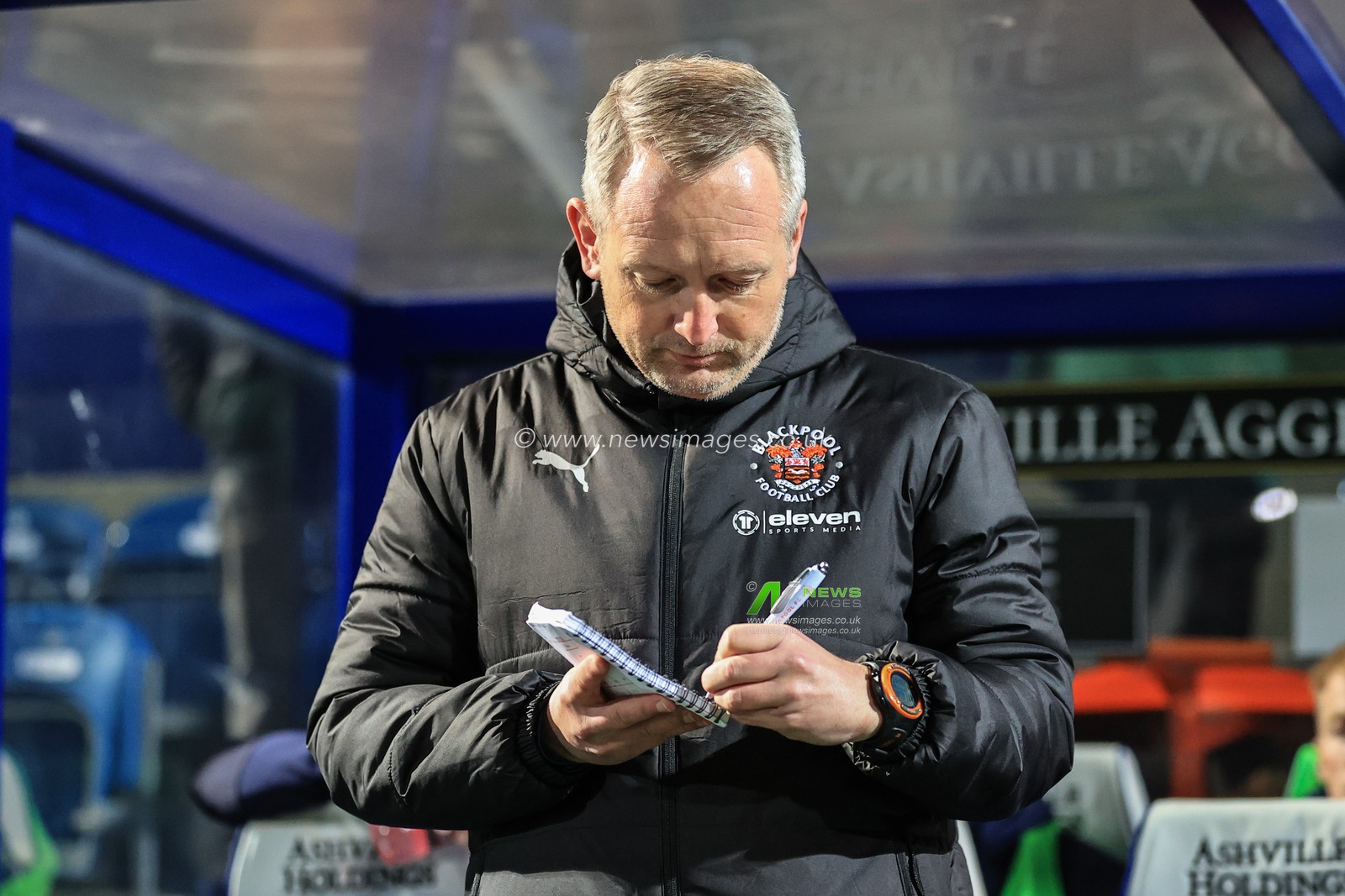Neil Critchley head coach of Blackpool takes notes