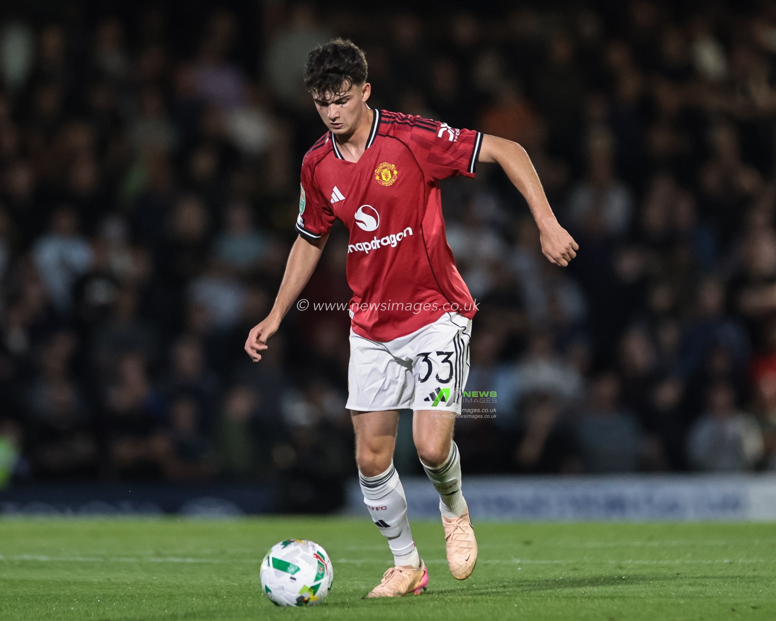 Tyler Fredricson of Manchester United with the ball during the Carabao Cup match Grimsby Town vs Manchester United at Blundell Park, Cleethorpes, United Kingdom, 27th August 2025

(Photo by Mark Cosgrove/News Images)
