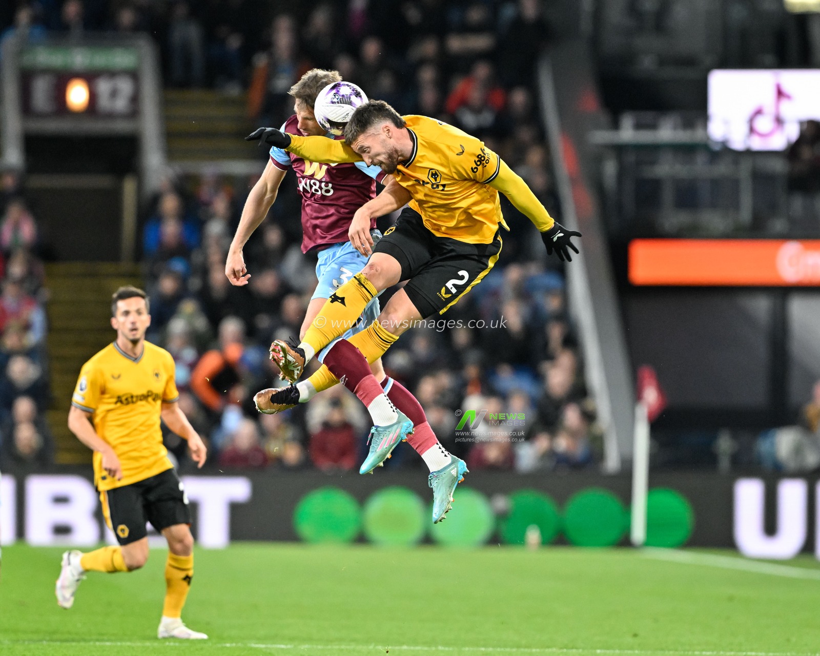 Charlie Taylor of Burnley and Matt Doherty of Wolverhampton Wanderers battle for the ball, during the Premier League match Burnley vs Wolverhampton Wanderers at Turf Moor, Burnley, United Kingdom, 2nd April 2024

(Photo by Cody Froggatt/News Images)