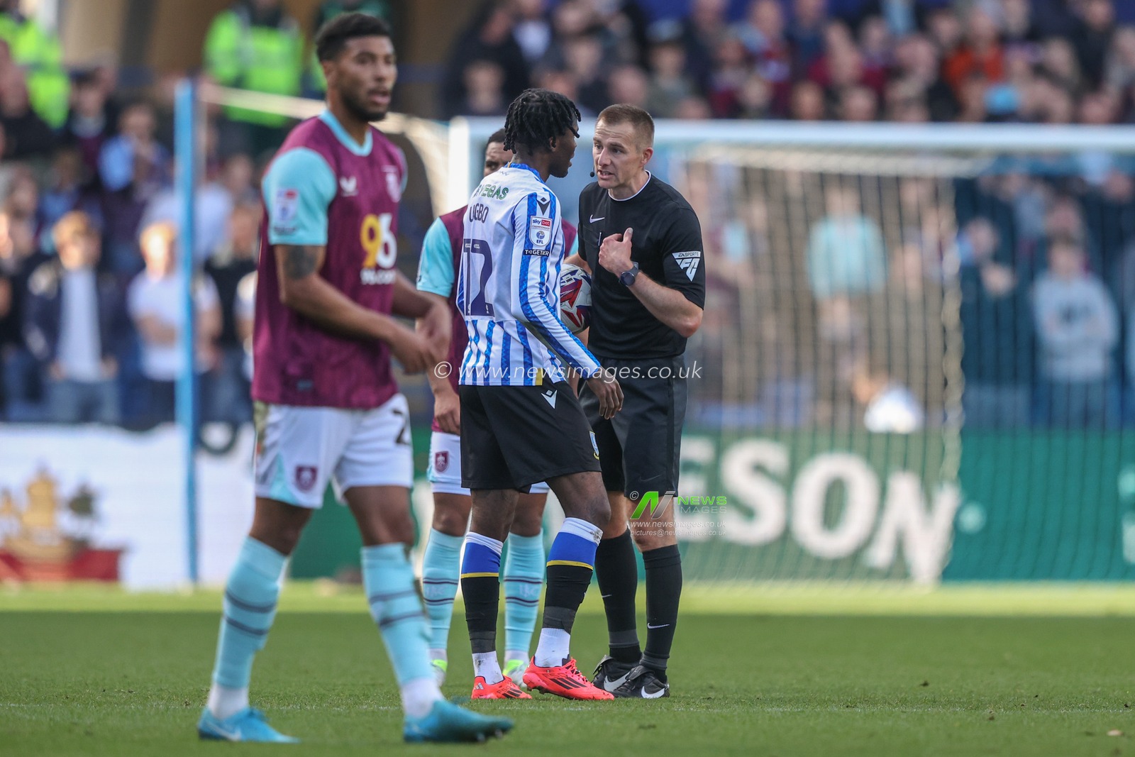 Referee Michael Salisbury talks to IkÃ© Ugbo of Sheffield Wednesday during the Sky Bet Championship match Sheffield Wednesday vs Burnley at Hillsborough, Sheffield, United Kingdom, 19th October 2024

(Photo by Alfie Cosgrove/News Images)
