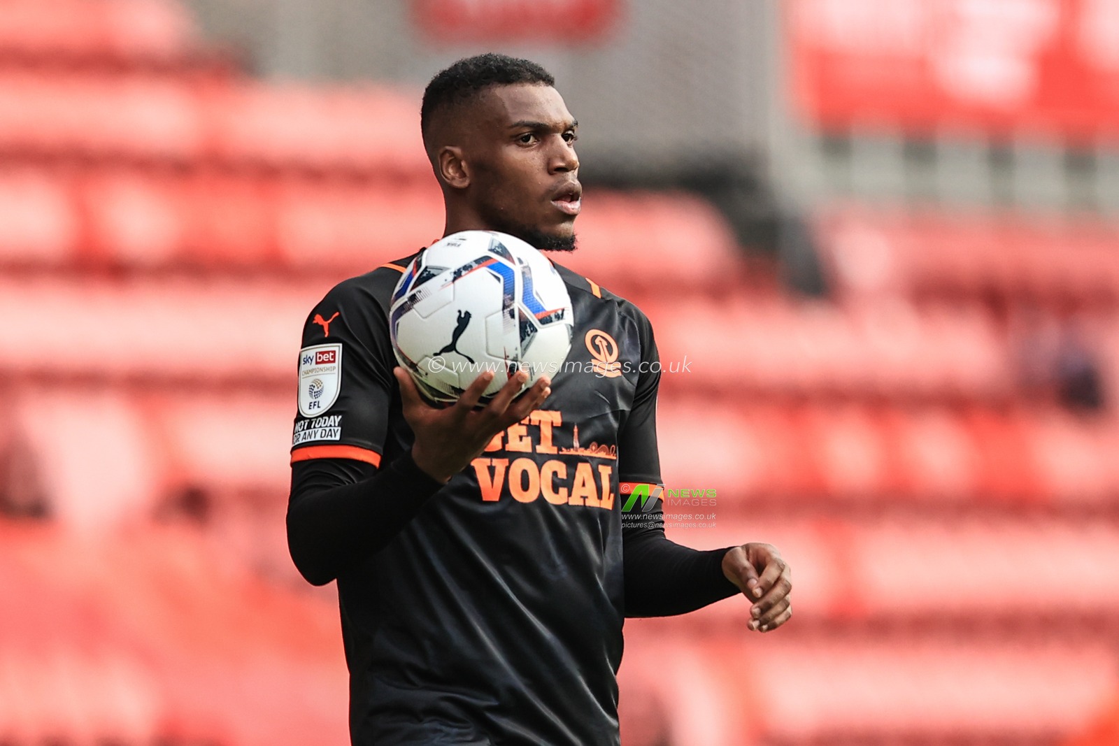 Dujon Sterling #35 of Blackpool prepares to take a throw-in