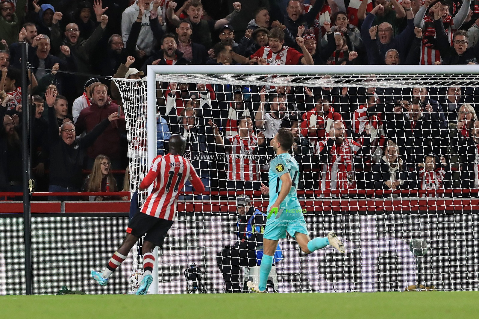 GOAL:  Yoane Wissa #11 of Brentford watches the deft flick of Ivan Toney #17 of Brentford roll into the net during the Premier League match Brentford vs Brighton and Hove Albion at Brentford Community Stadium, London, United Kingdom, 14th October 2022

(Photo by Carlton Myrie/News Images)