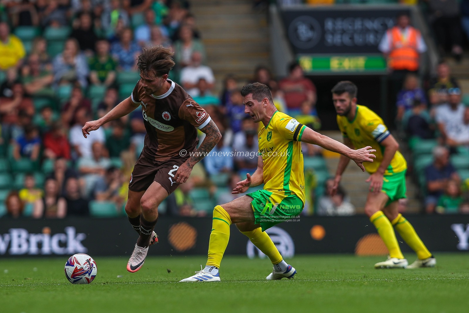 Connor Metcalfe of St Pauli is put under pressure by Kenny McLean of Norwich City during the Pre-season friendly match Norwich City vs St. Pauli at Carrow Road, Norwich, United Kingdom, 3rd August 2024

(Photo by Izzy Poles/News Images)