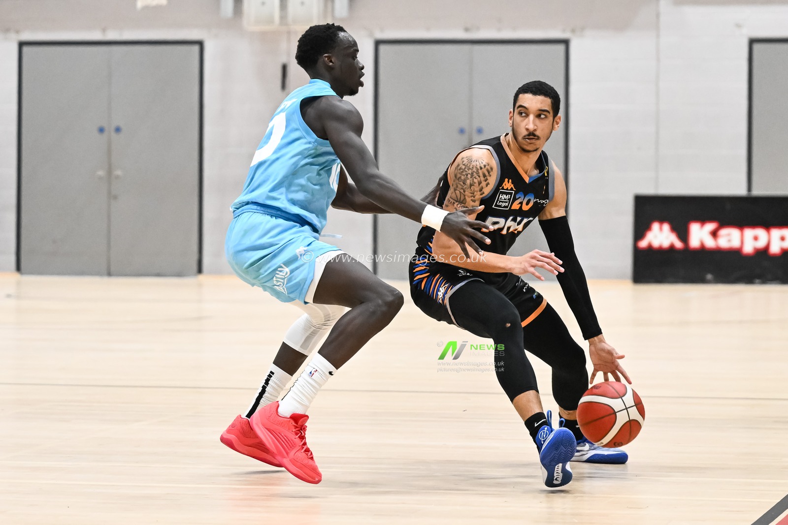 EJ Stephens of Cheshire Phoenix holds off Padiet Wang of Surrey Scorchers during the British Basketball Championship match Cheshire Phoenix vs Surrey Scorchers at Ellesmere Port Sports Village, Ellesmere Port, United Kingdom, 19th November 2023

(Photo by Craig Thomas/News Images)